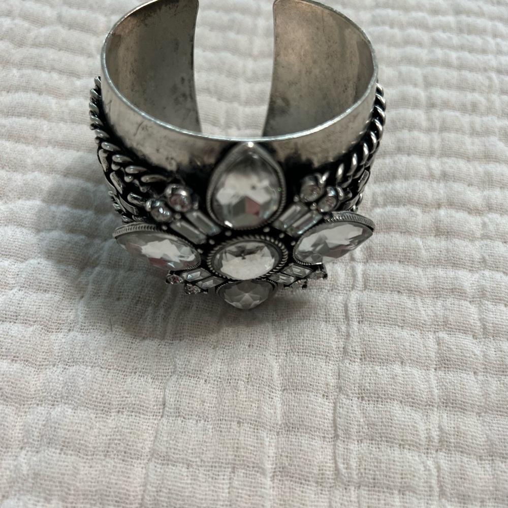 Silver cuff bracelet with faux diamonds.